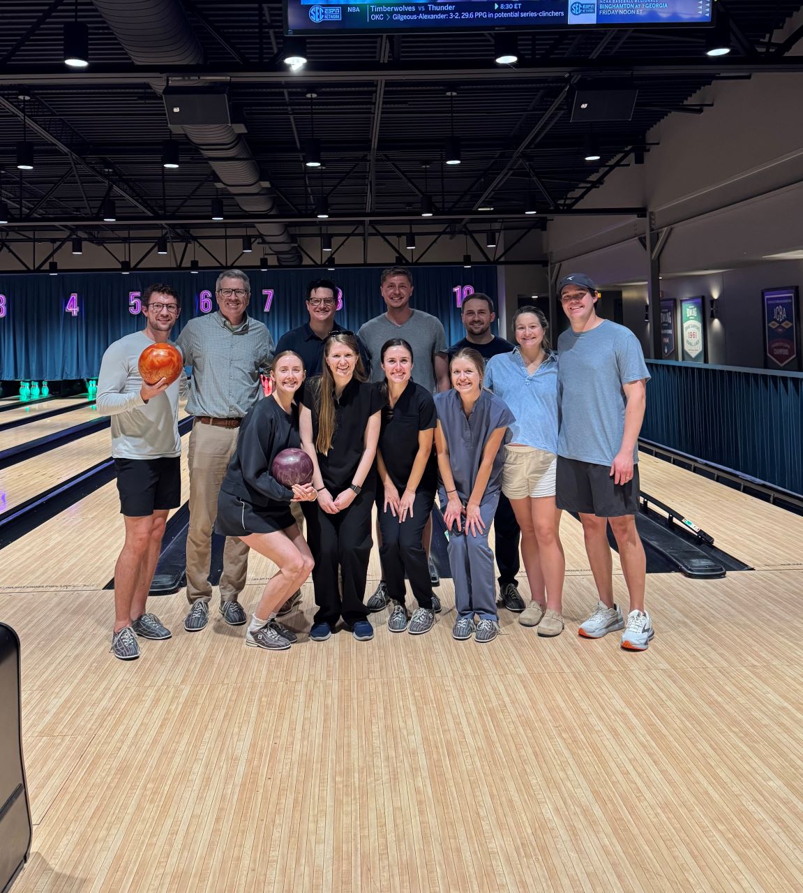 Dr. Jeremy Jackson (second from left) recently hosted a resident retreat at Highball Lanes on May 28th. Faculty, residents, and residents' spouses enjoyed an evening of fellowship and competition.